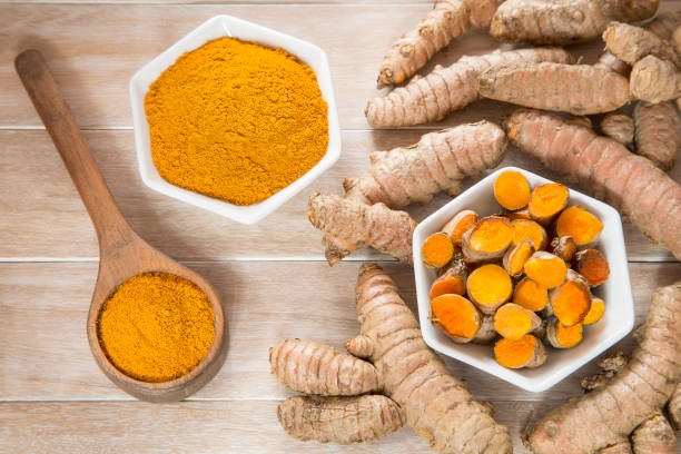istock Turmeric powder and fresh turmeric - Curcuma longa. 1144209827