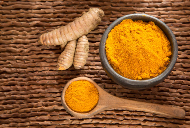 istock Turmeric powder and fresh turmeric - Curcuma longa. 1144211850