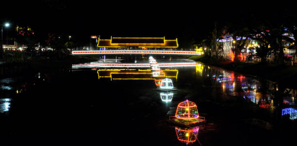 istock covered bridge over a small river, night lighting, neon lights 1144213479
