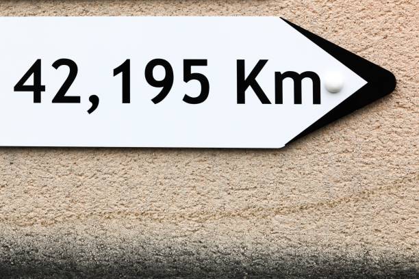 Marathon distance signboard on a wall
