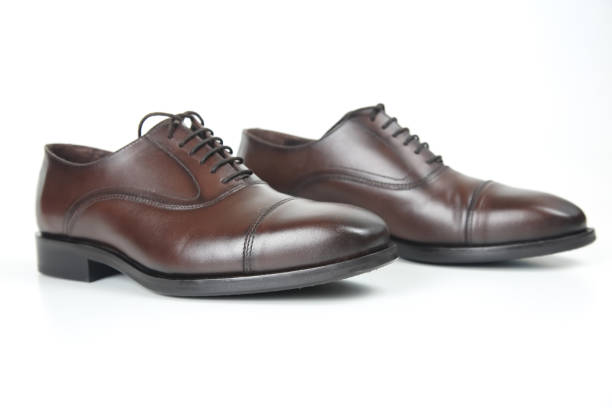 istock Classic men's brown shoes on white background. Leather shoes 1144219111