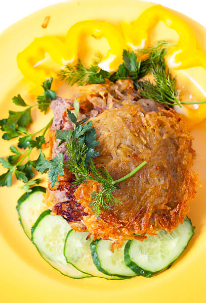 Meal from potato and forcemeat on a yellow plate stock photo