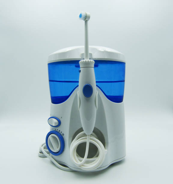 istock Irrigator and electric toothbrush on white background 1144221815