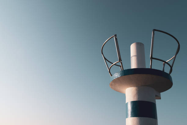 Beacon to mark the entrance to a harbour