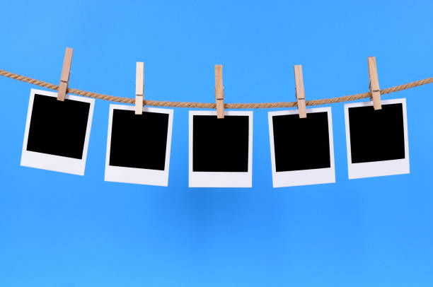 istock Blank instant photo prints on a washing line 114422438