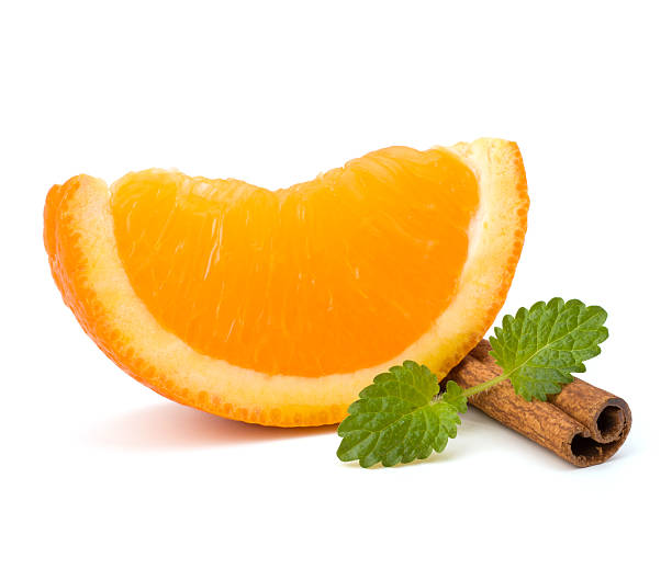istock Orange fruit part, cinnamon stick and green mint 114422691