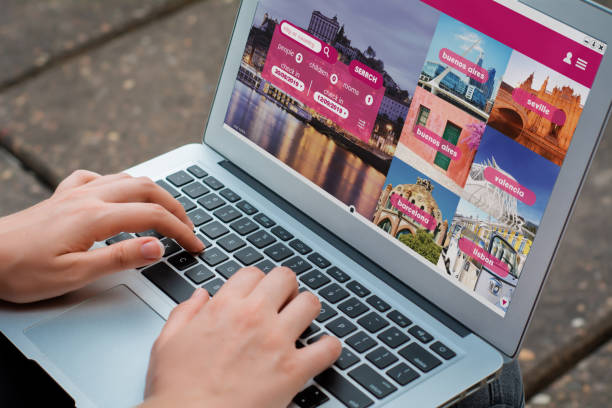 istock Woman with laptop booking a hotel on website 1144227784