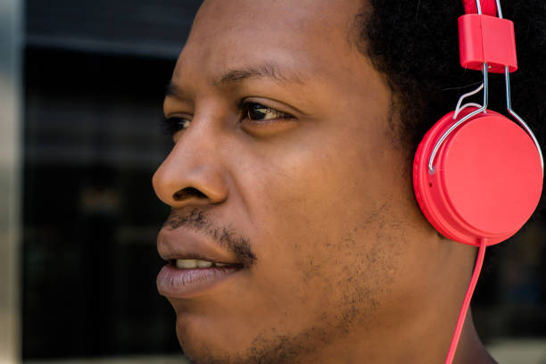 istock Young man enjoying music outdoor. 1144227803