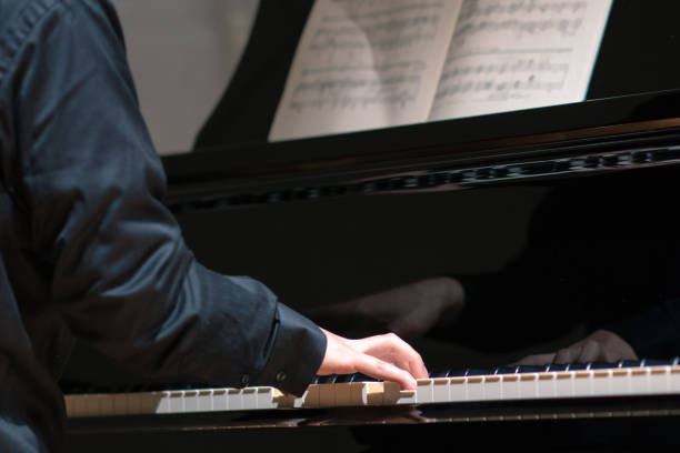 istock Man playing piano at classical music concert 1144229265