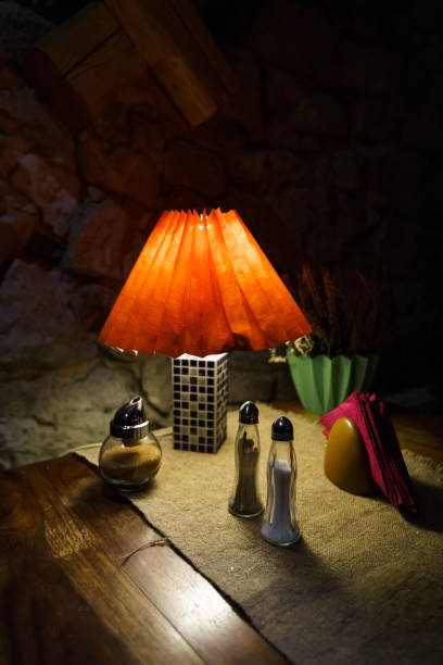istock Restaurant table light with salt and pepper and napkins 1144229374