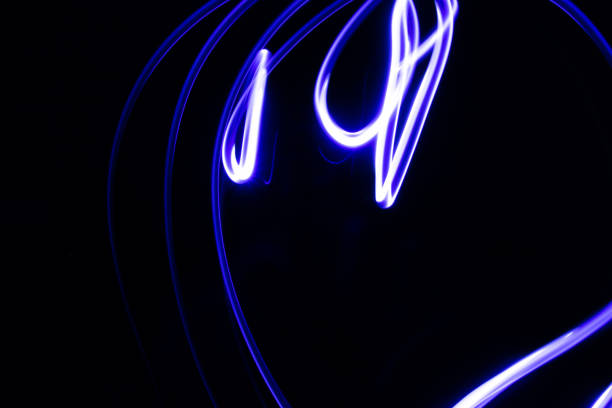 istock Abstract neon lights trails in the black background. Futuristic overlay light pattern. 1144230159