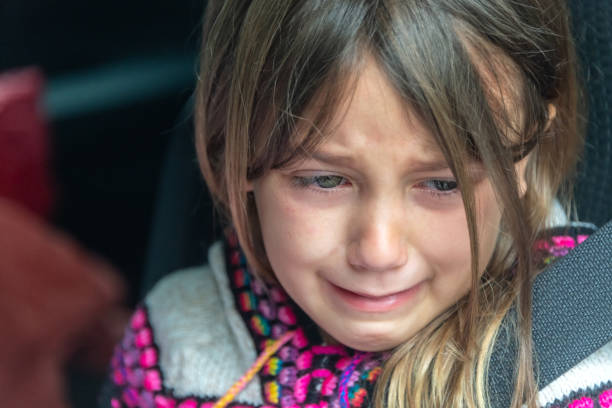 Sad crying caucasian little girl