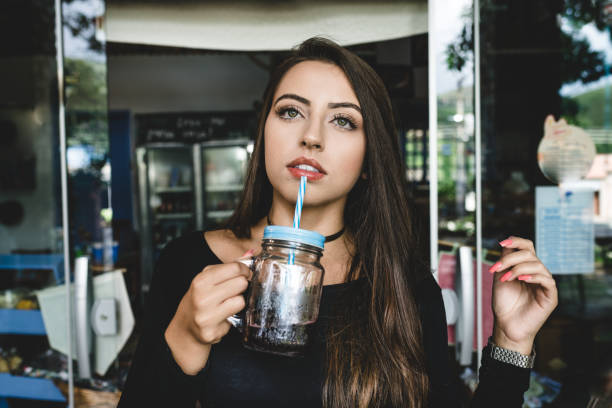 istock Young woman tasting natural juice 1144233769