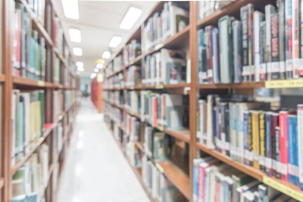 istock Blur school library or study room with book shelves for education background 1144234499