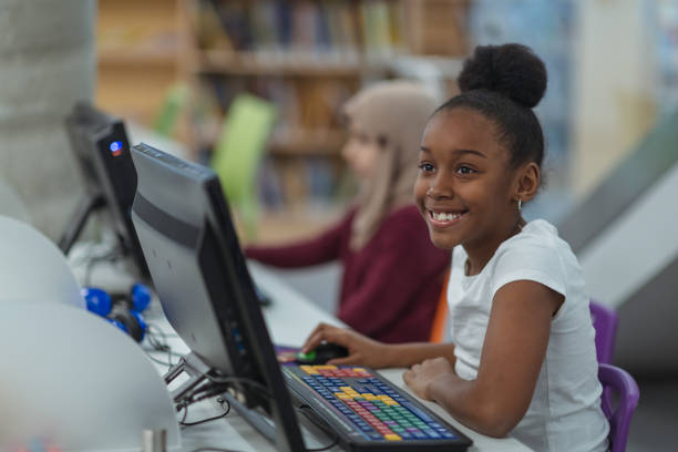 istock Smiling computer girl portrait 1144235196