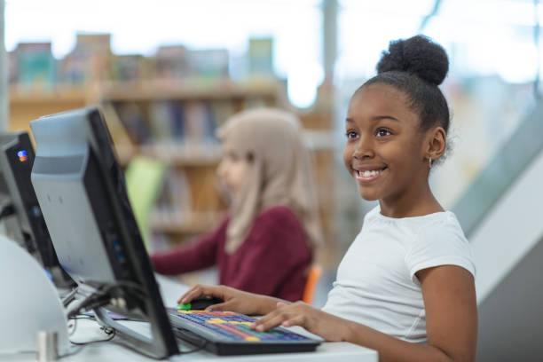 istock Smiling computer girl portrait 1144235197