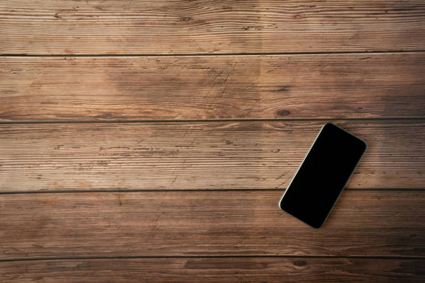istock Vintage Phone mockup flat lay on old table top old wood background texture space concept workspace office blank note, plan on calendar new year 2019, business blogger idea empty wooden view 1144235245