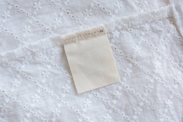 istock blank laundry care clothes label on fabric texture background 1144235262