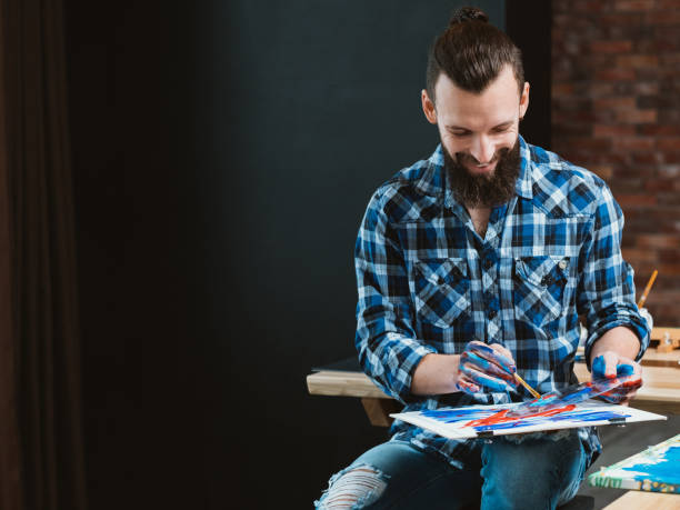 istock modern workshop enthusiastic young artist painting 1144235510