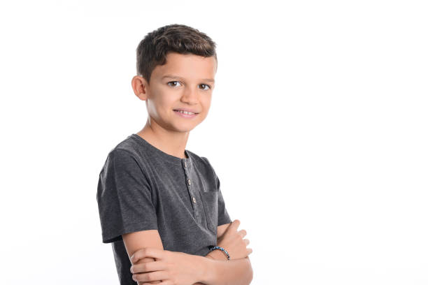 istock portrait of a young boy kid studio shot on white background 1144235663