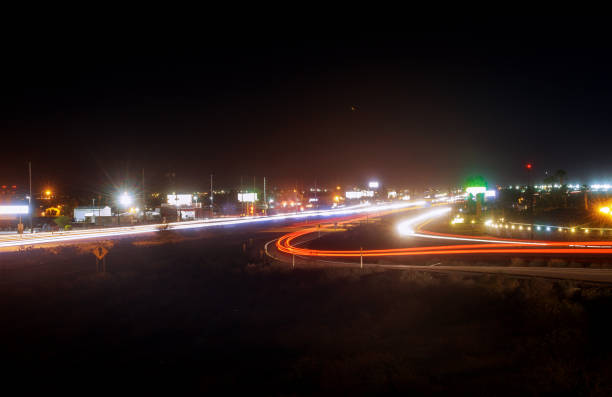 istock Speed traffic light highway at night, long exposure abstract urban background 1144237903