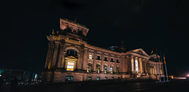 istock Reichstag in Berlin, Germany at night, illuminated with warm light 1144238915