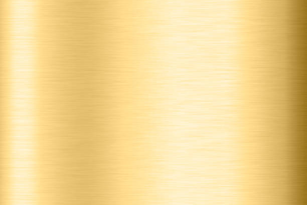 Abstract Shiny smooth foil metal Gold color background Bright vintage Brass plate chrome element texture concept simple bronze leaf panel hard backdrop design, light polished steel banner wallpaper. stock photo