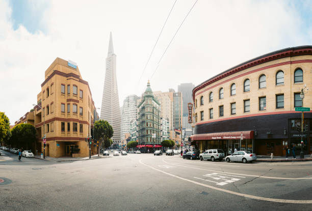 San Francisco skyline with Transamerica Pyramid and Columbus Tower, California, USA SEPTEMBER 3, 2016 - SAN FRANCISCO: Central San Francisco with famous Transamerica Pyramid and historic Sentinel Building at Columbus Avenue on a cloudy day, California, USA columbus avenue stock pictures, royalty-free photos & images