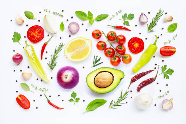 istock Various fresh vegetables and herbs on white background. Healthy eating concept 1144244545