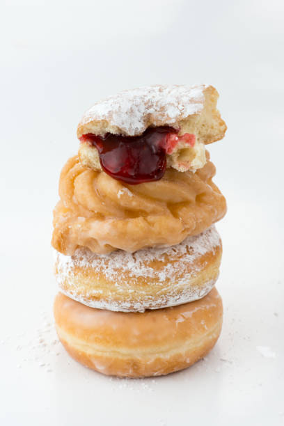 istock Comfort food in Canada: Sugar dusted and jam stuffed donuts on wihte 1144244770