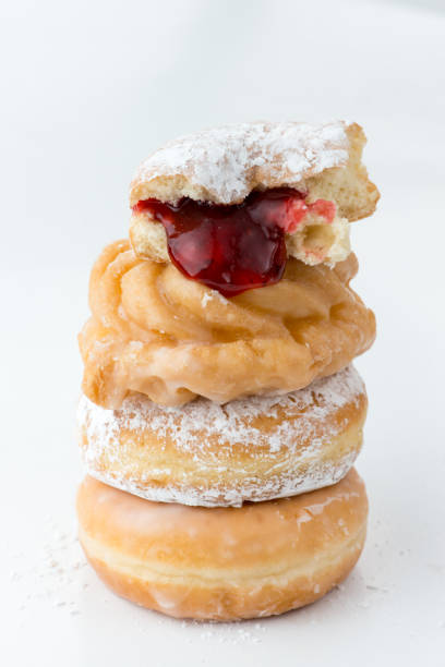 istock Comfort food in Canada: Sugar dusted and jam stuffed donuts on wihte 1144244779