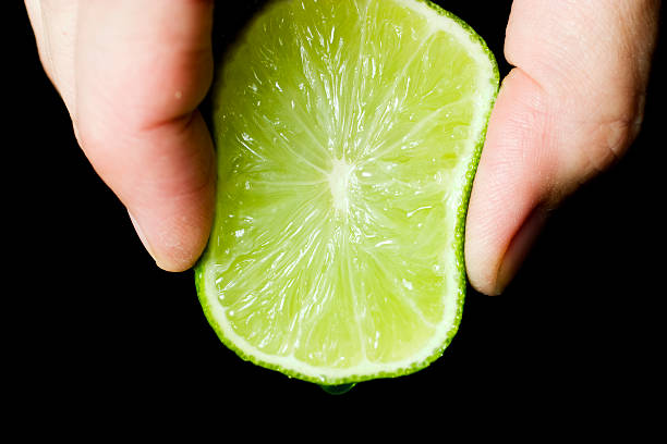 lime squeezed stock photo