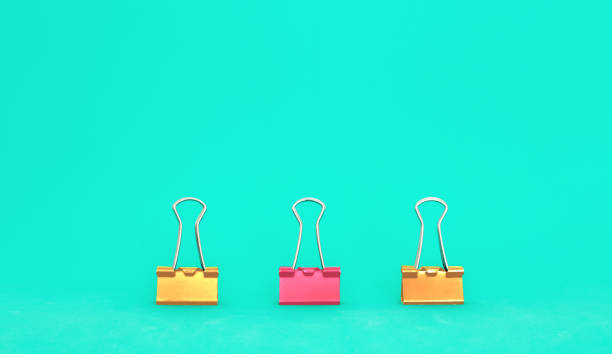 istock Unique, leadership, individuality, and think different concept. Office supplies, one binder paper clip difference with other clips 1144245895