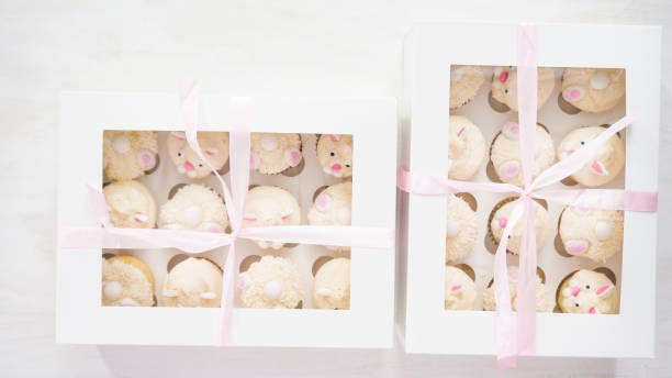 istock Boxing vanilla cupcakes in shape of Easter bunnies. 1144246738