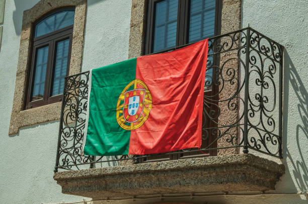 istock Portuguese flag on iron railing in a balcony from an old building 1144250726