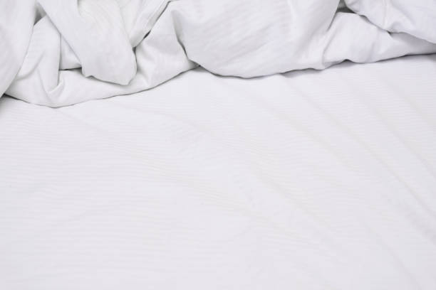 istock White delicate soft background of fabric or bedding sheet 1144250879
