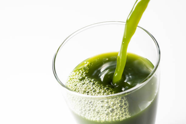 istock Pouring green juice into a glass 1144250991