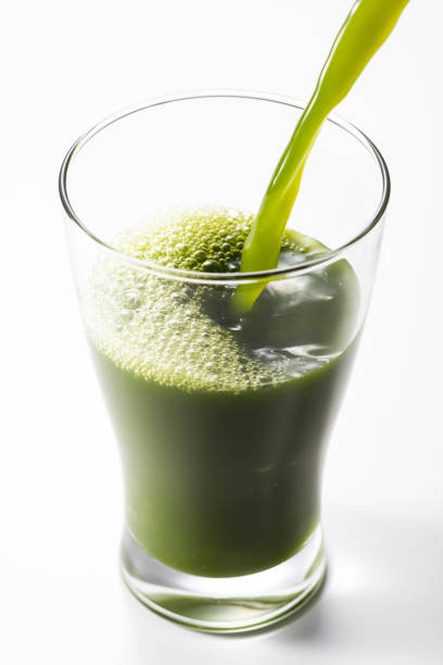 istock Pouring green juice into a glass 1144251000