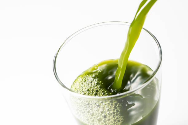 istock Pouring green juice into a glass 1144251016