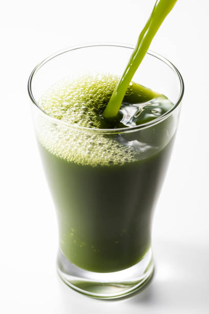 istock Pouring green juice into a glass 1144251526