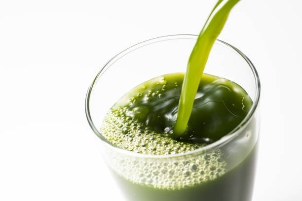 istock Pouring green juice into a glass 1144251530