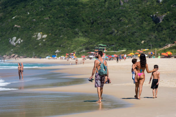 Trancoso, district of Porto Seguro, BA, Brazil - January 06, 2023: people on Nativos Beach enjoying the day on the beach.