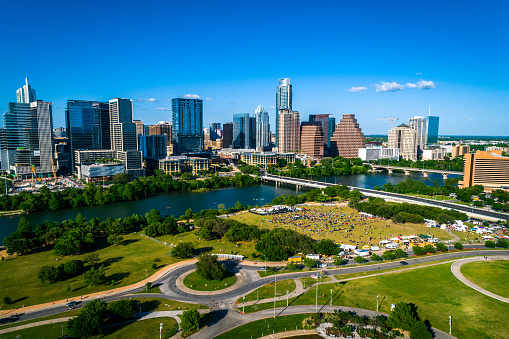 Austin Texas summer time 2019 aerial drone view above downtown skyline cityscape capital city of Texas  with large crowd below