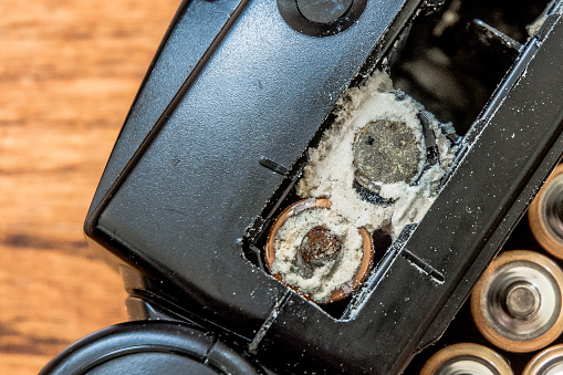 Corroded AA Batteries inside a flash