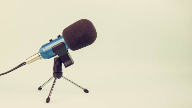 istock Blue microphone with wire on stand in vintage style. 1144255100