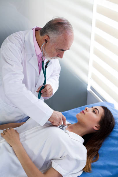 istock Doctor examining woman 1144255703