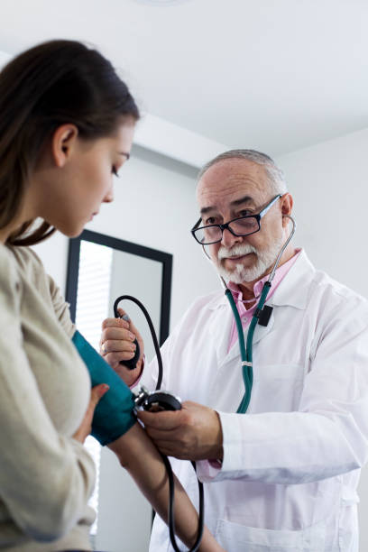 istock Doctor examining woman 1144255744