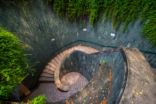 Spiral staircase of underground crossing in tunnel at Fort Canning Park, Singapore