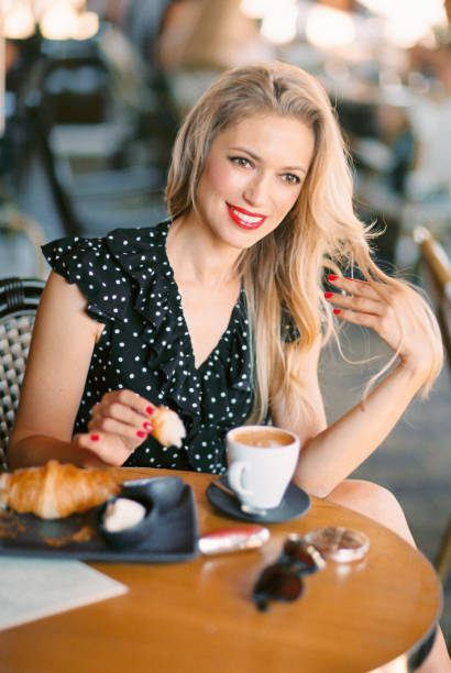 istock Beautiful woman sitting in cafe. 1144255876