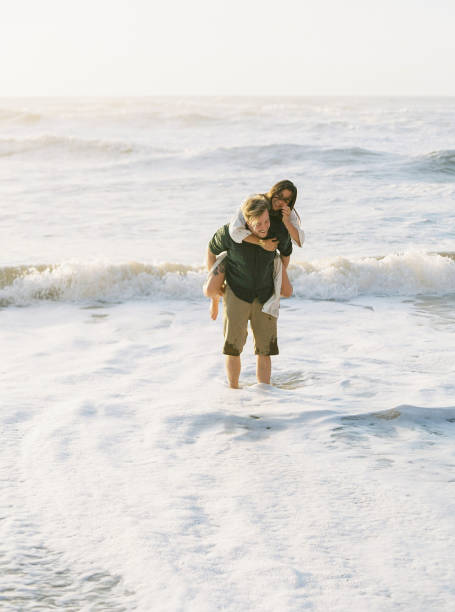 istock Young couple in love on beach. 1144256766